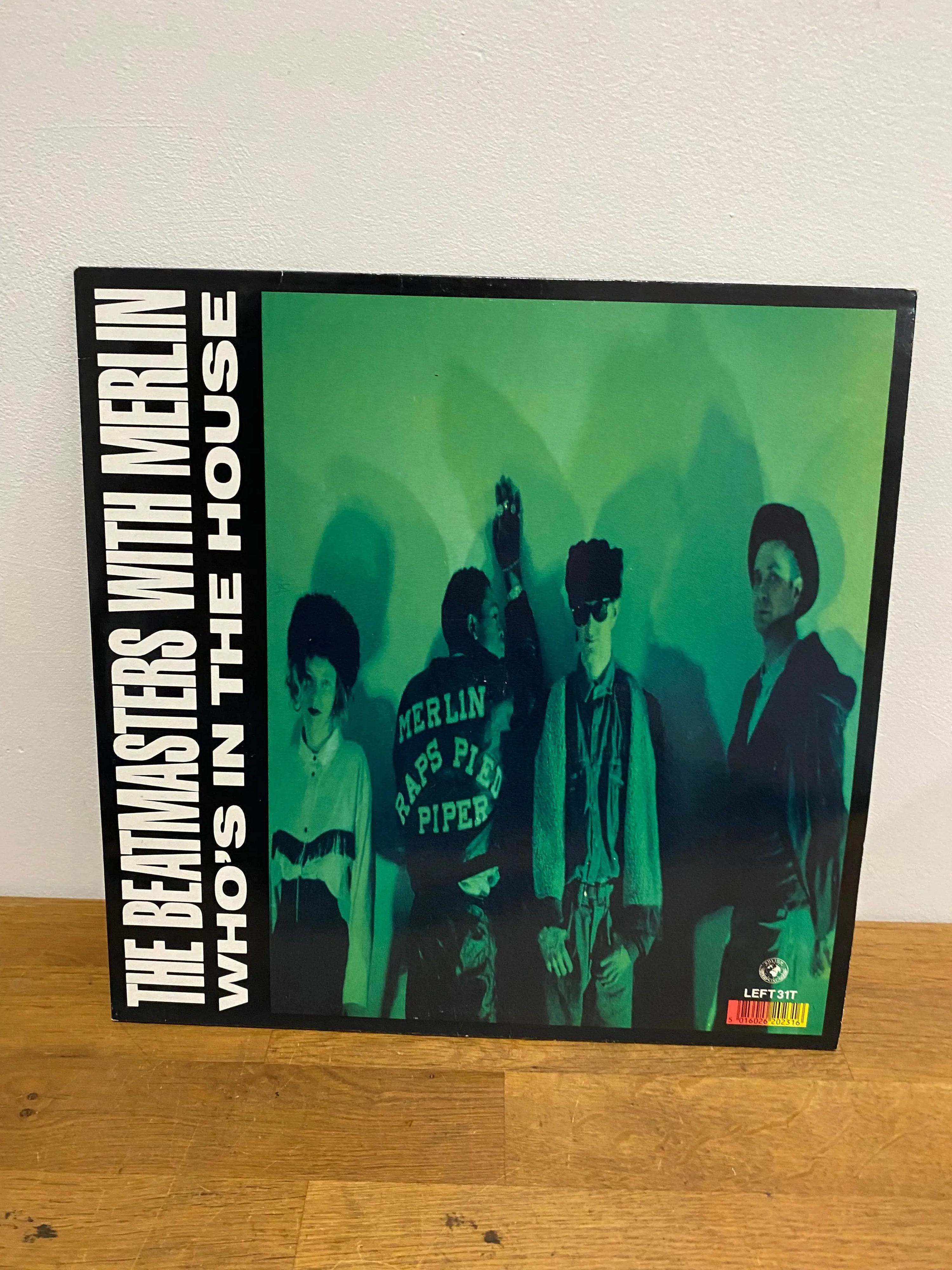 Who’s in the House by The Beatmasters with Merlin 12 inch record with sleeve