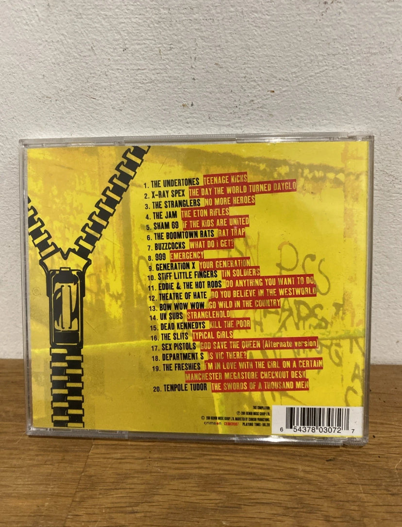 Back cover of Teenage Kicks Punk 2 CD Album with yellow background and zip illustration and track listings