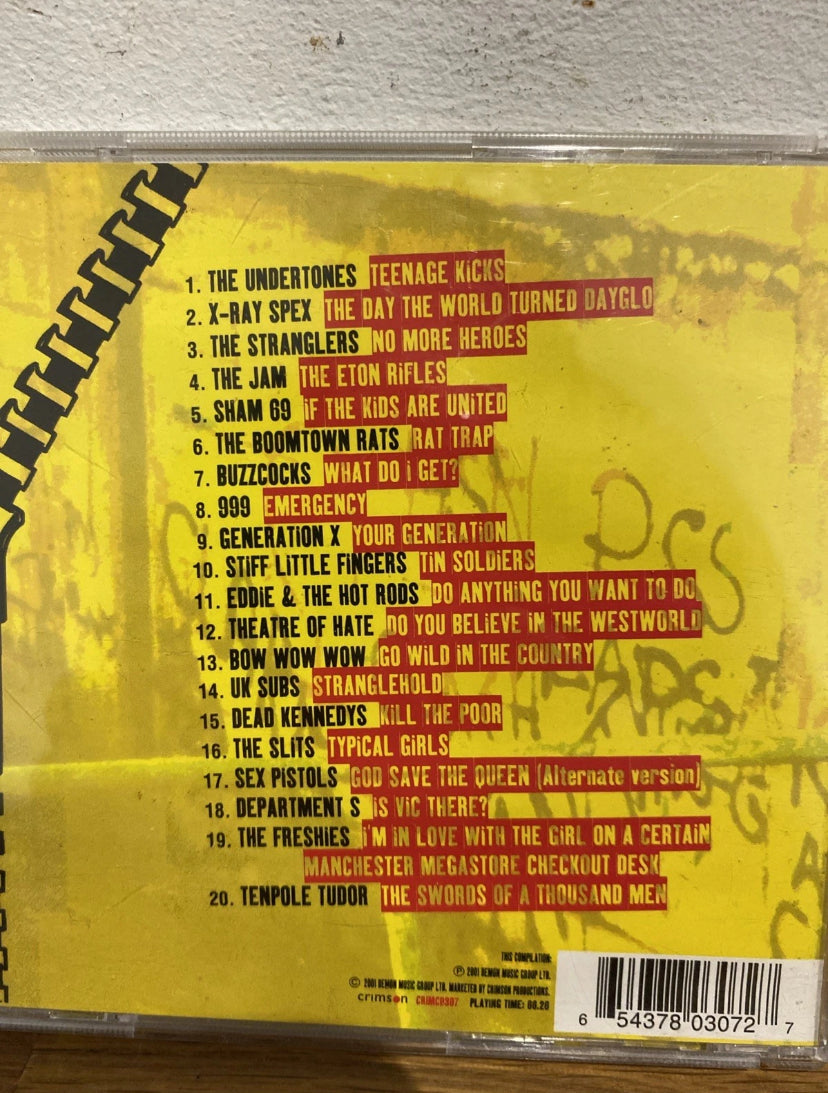 Back cover of Teenage Kicks – Punk 2 CD Album with track listings and artist names on a yellow background